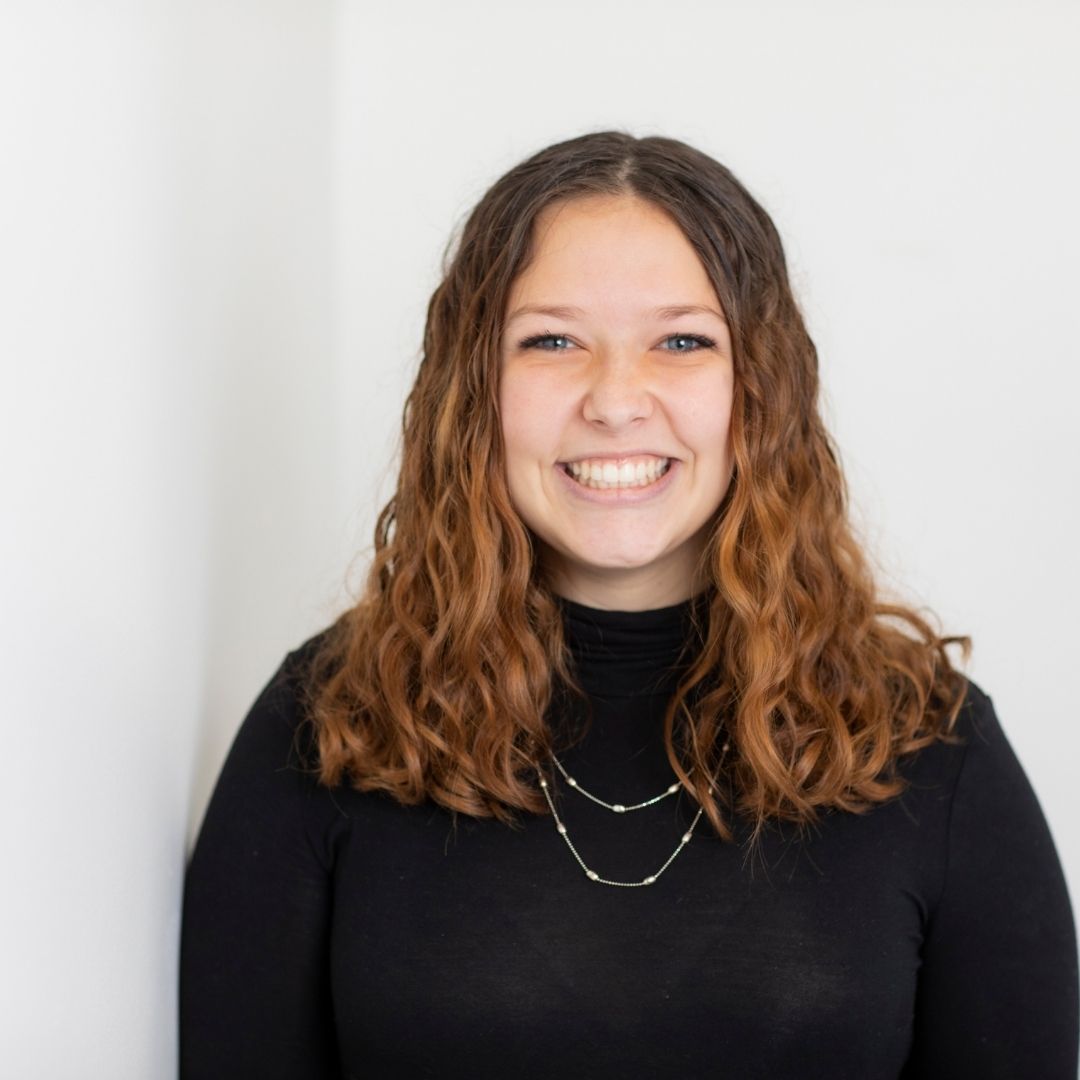 Jillian Lawrence smiling in a professional headshot, representing her role in visual content creation.